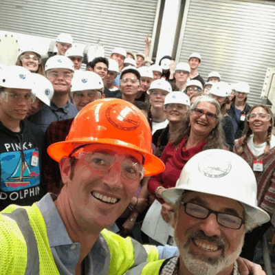 Photo of two tour guides with students in background.