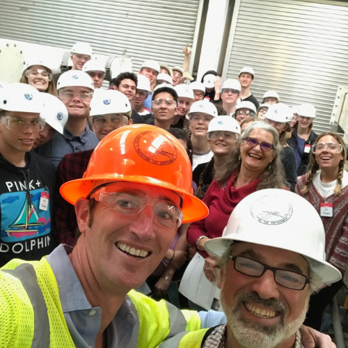 Photo of two tour guides with students in background.